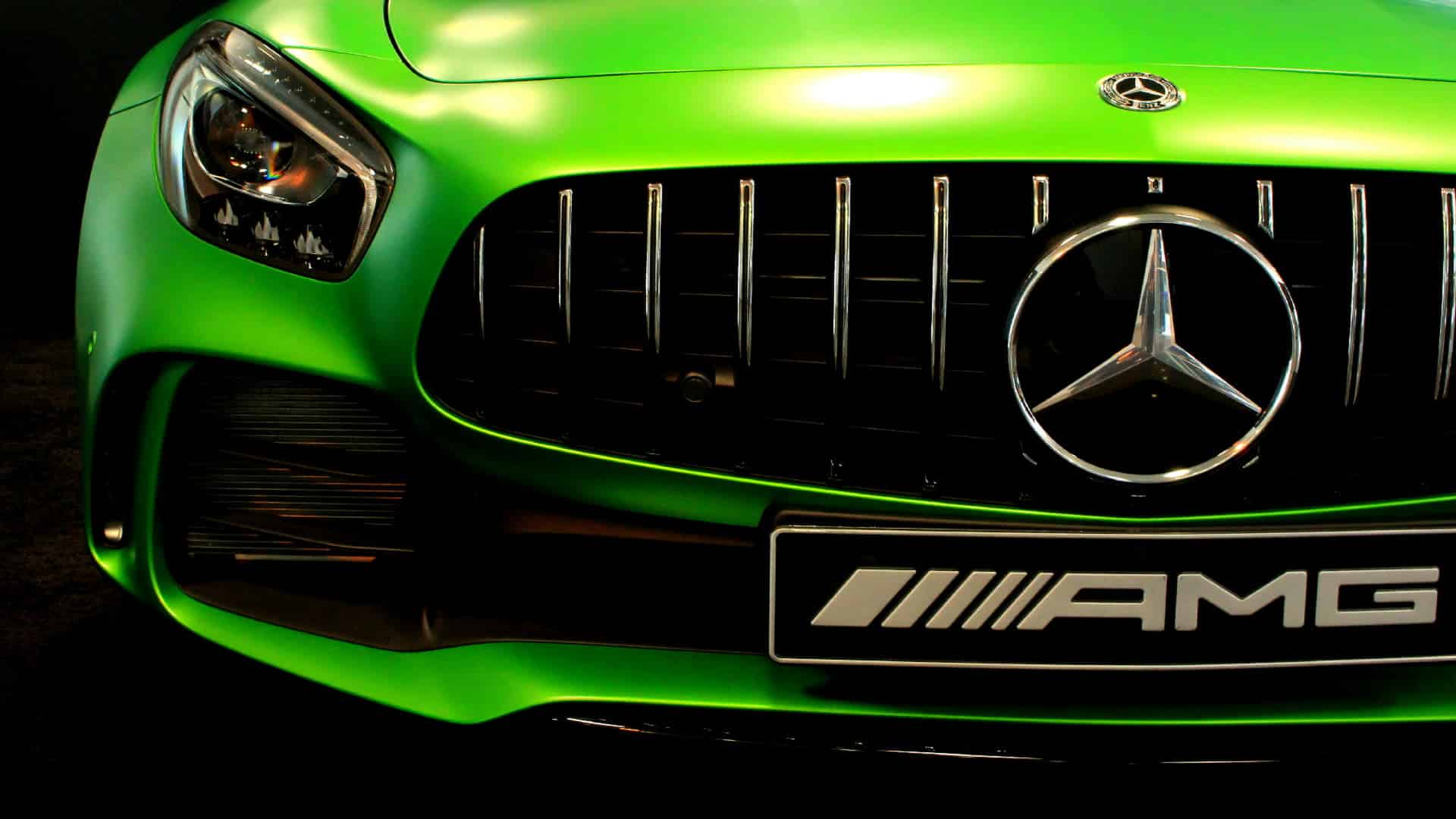 Green Mercedes AMG front grille showcasing performance design - sell my catalytic converter uk