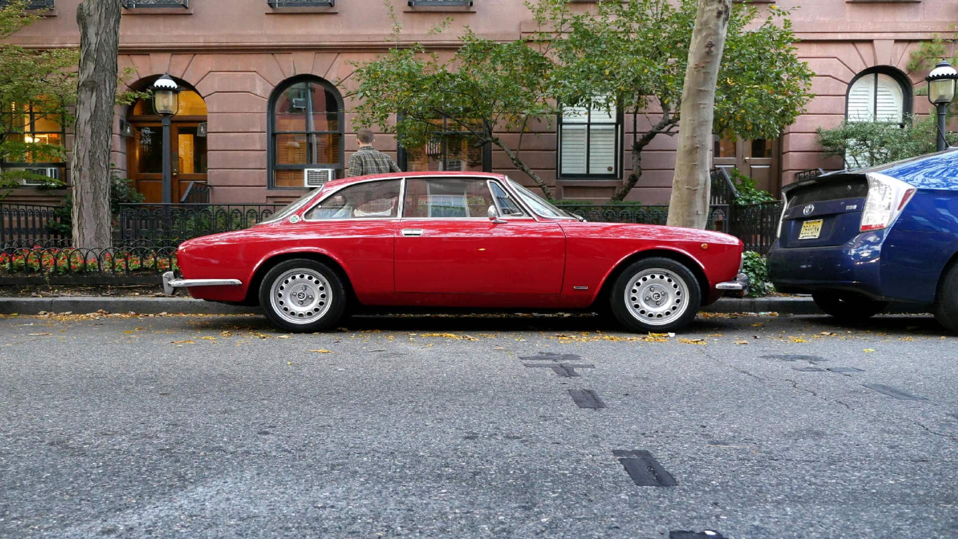 Vintage red sports car side profile with sale catalytic converter focus for Catman website