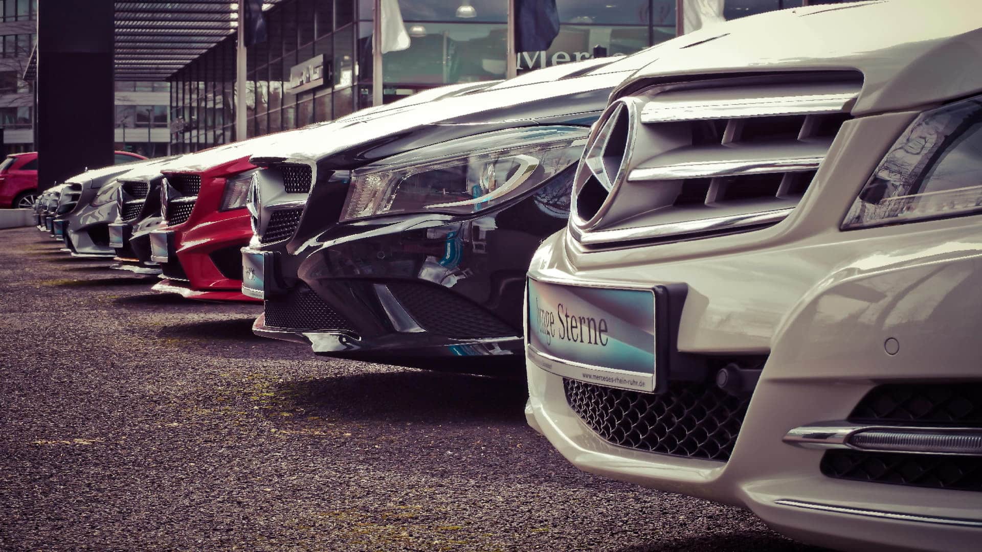 Front view of multiple Mercedes Benz cars parked at dealership, ideal for buy catalytic converter near me SEO for Catman