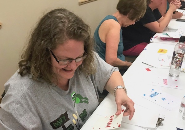 Woman making layered adhesive vinyl decal