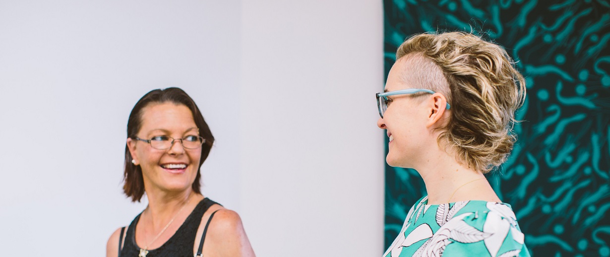 A client smiles at a Caxton lawyer