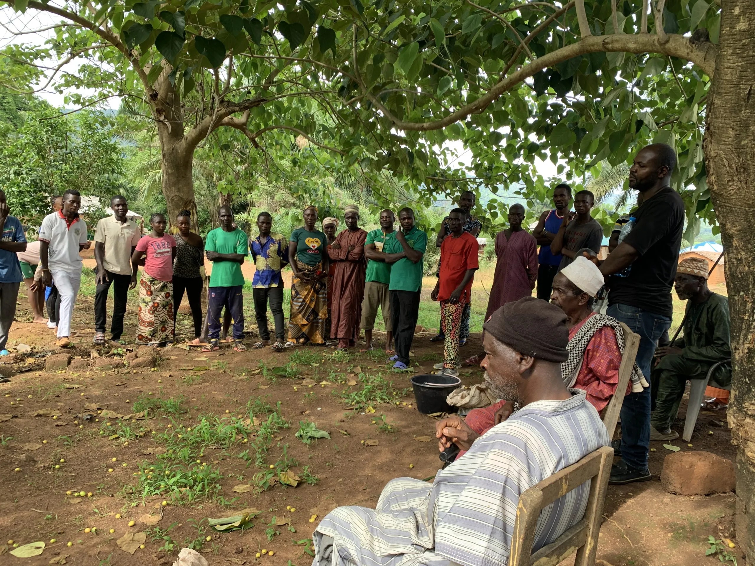 People standing in a circle for a group discussion