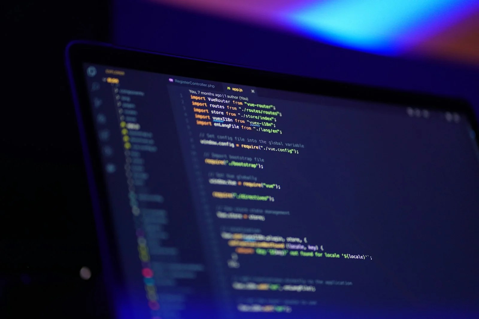 Claude Code vs Codex compared on a laptop screen displaying code
