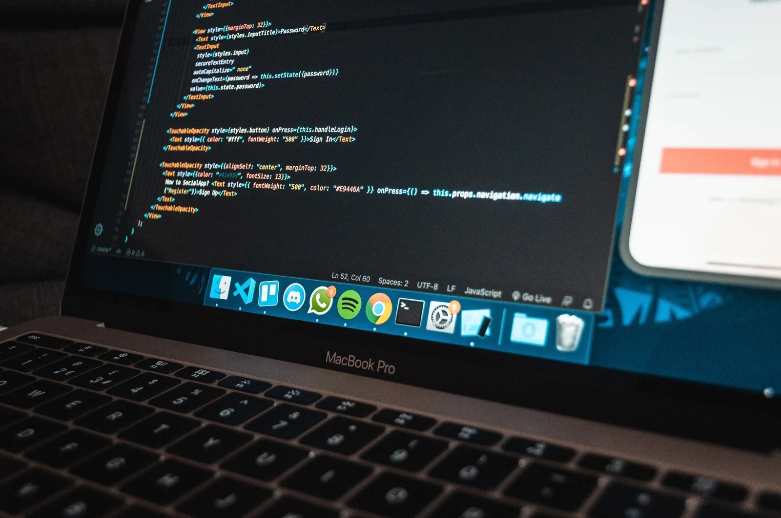 CodeSignal general coding assessment guide showing program code on a laptop screen