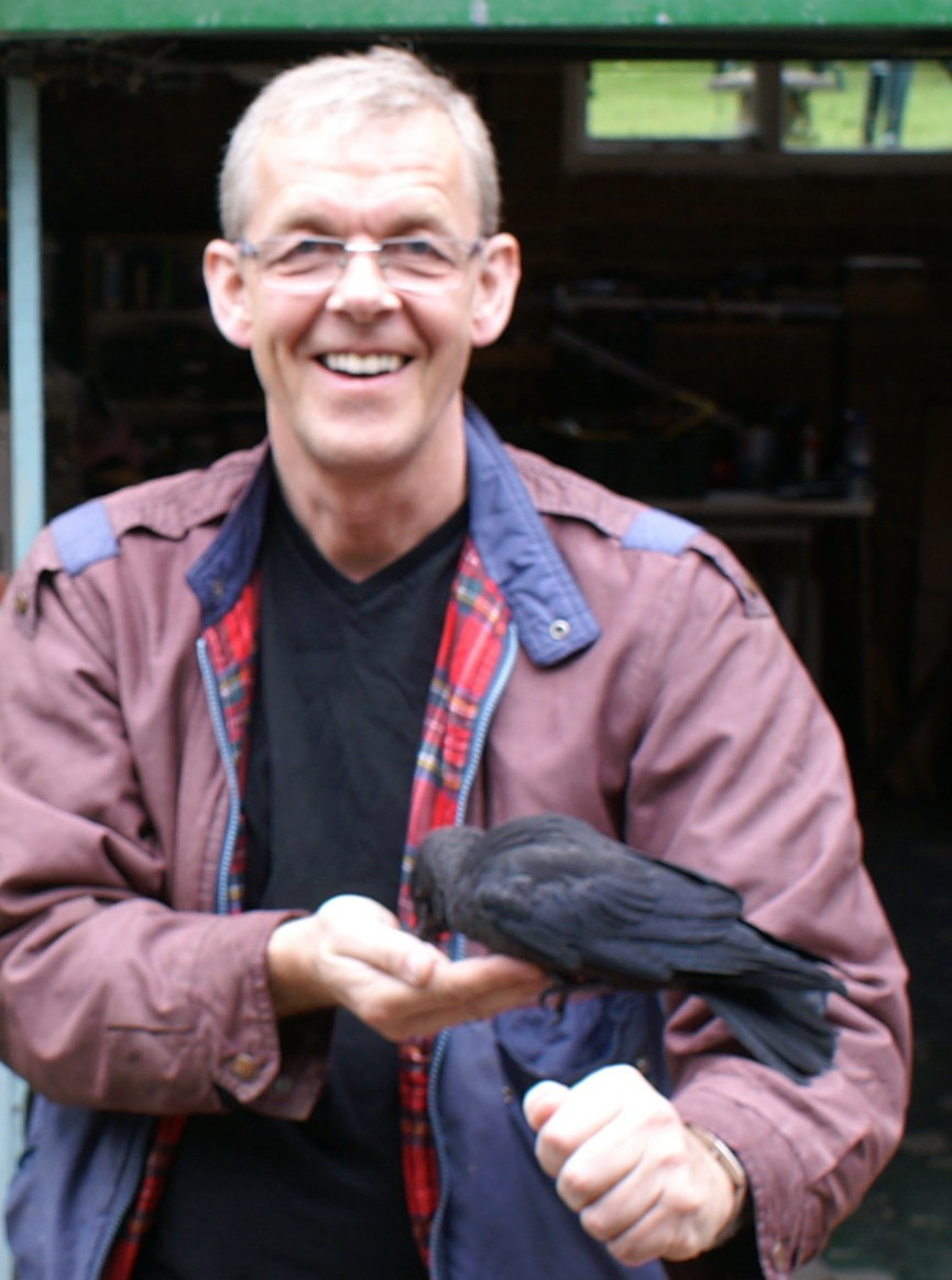 Andy holding a crow in his hand