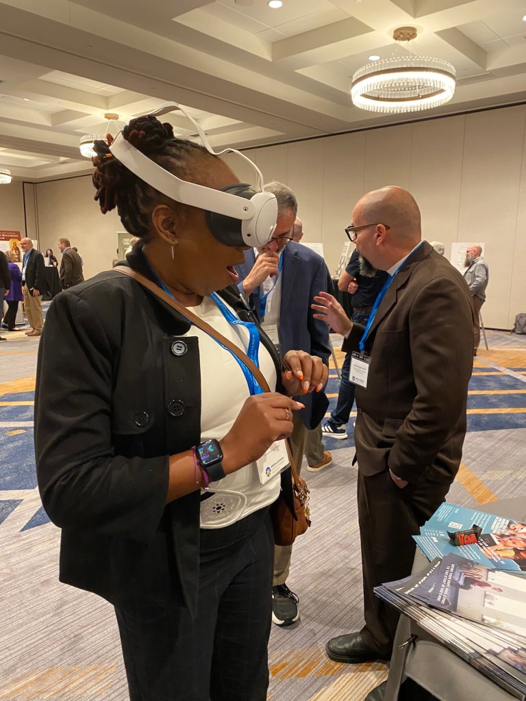 a woman with an amazed expression wearing virtual reality goggles