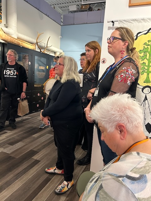 people standing in a museum