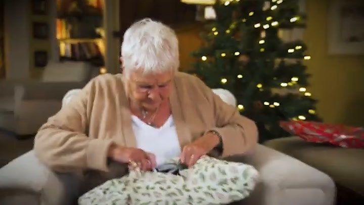 Judi Dench left red-faced after opening charity Christmas present