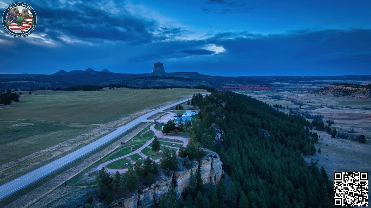 Aerial view of a property near Devils Tower and its surrounding landscape