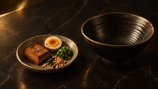 A small tasting station with ramen ingredients arranged in separate portions