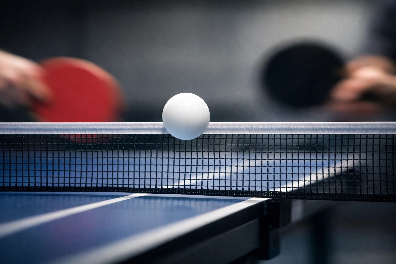 Macro photo of a table tennis ball over a net illustrating high-speed AI camera precision.