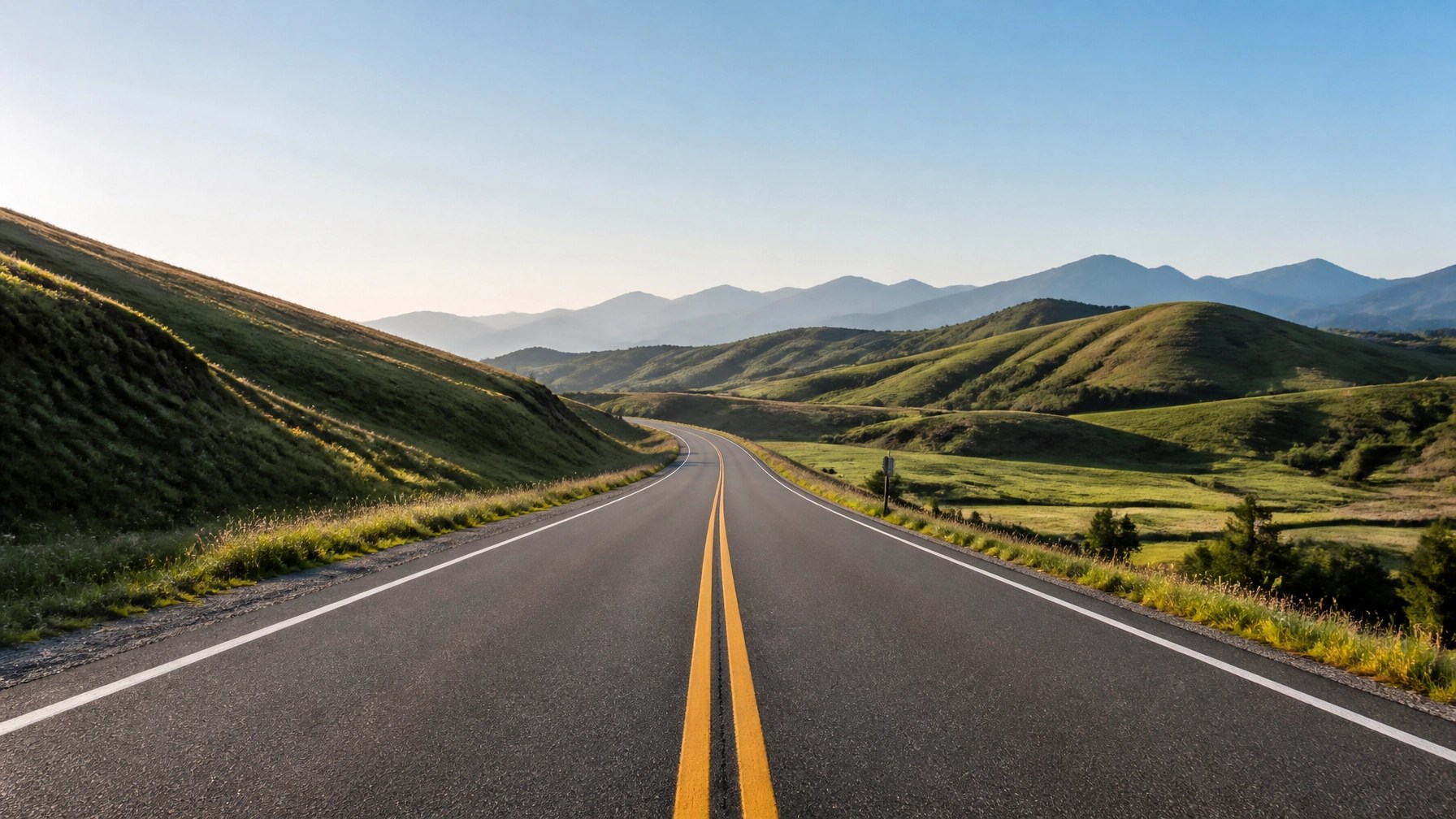 A peaceful rural road representing the reach of professional medical transport into remote areas.