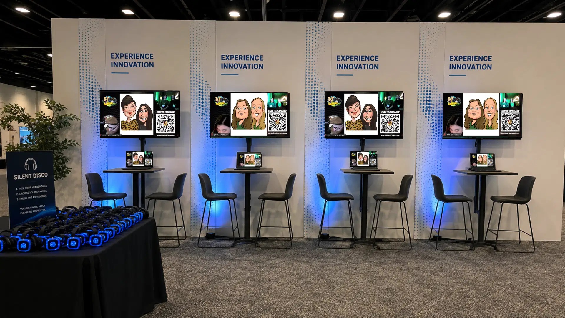 Interactive trade show lounge featuring digital caricature stations, large displays, and scannable QR codes.