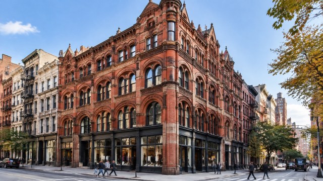 The historic Puck Building on Lafayette Street in SoHo, shown with pedestrians passing along the sidewalk