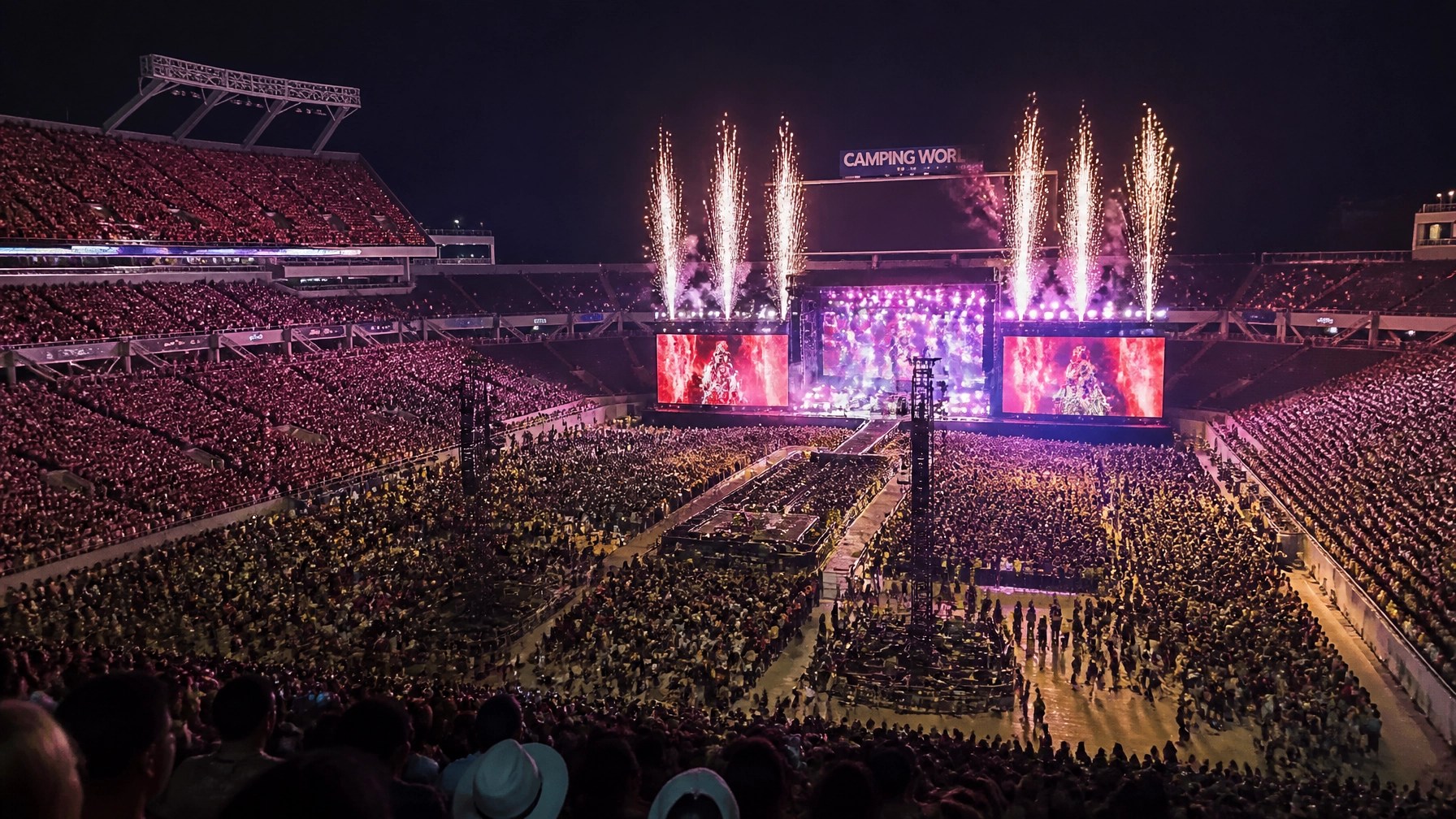 A wide-angle view of the massive stadium crowd and electric atmosphere during the R&B Tour.