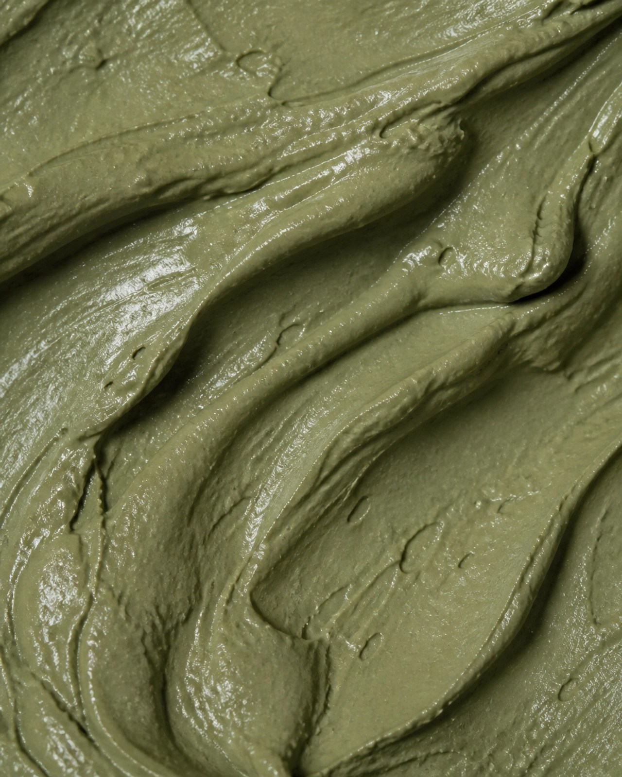 Close-up of the rich, mineral-dense texture of French green clay