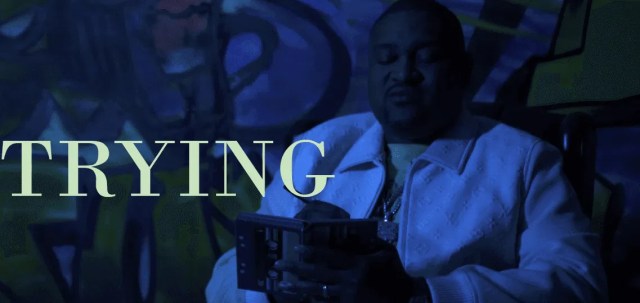 HUMEN music video still showing a man reflecting with a journal