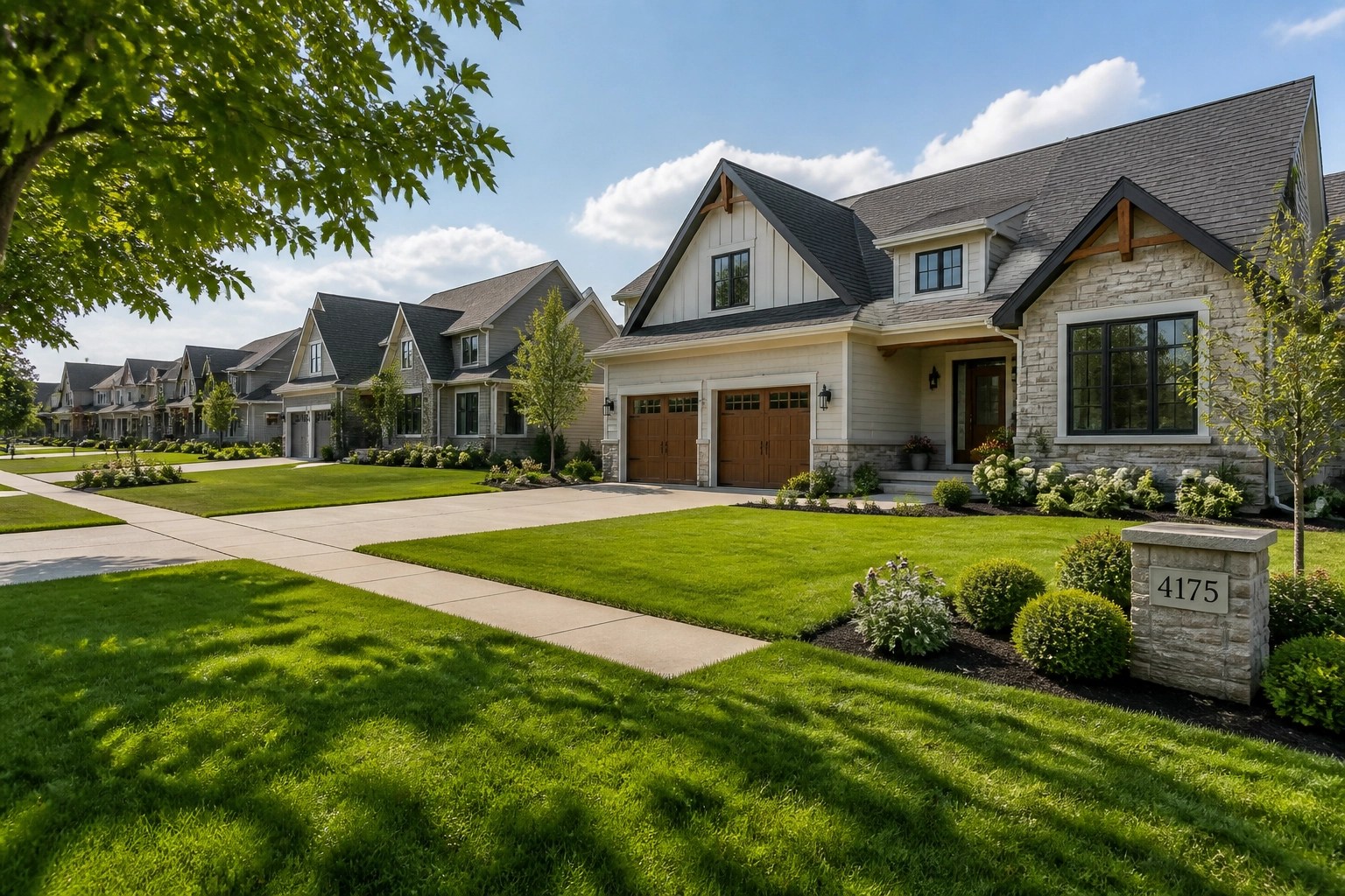 Contemporary houses for sale in Greene County Ohio on a sunlit suburban street.
