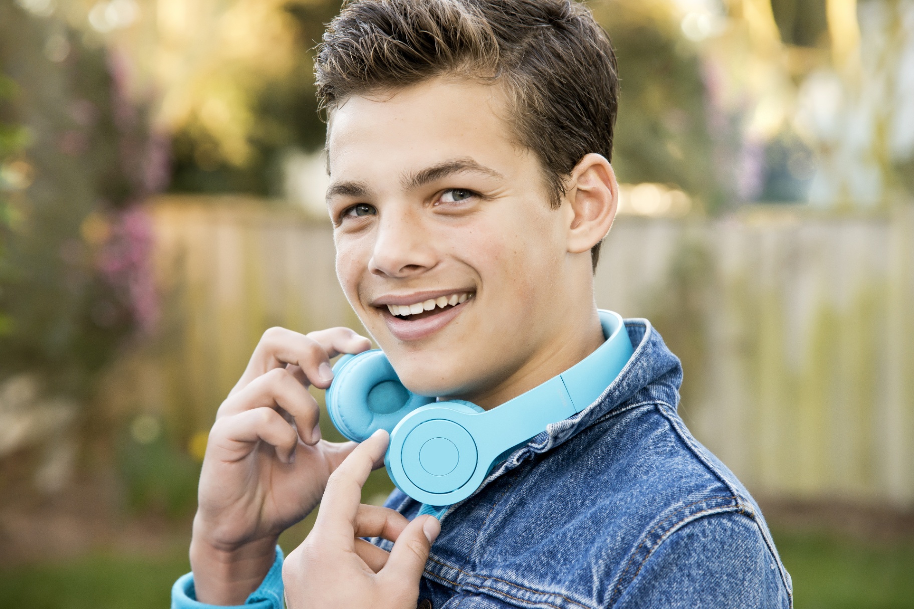 Teenage Boy Senior Portrait with Denim Jacket and Blue Headphones