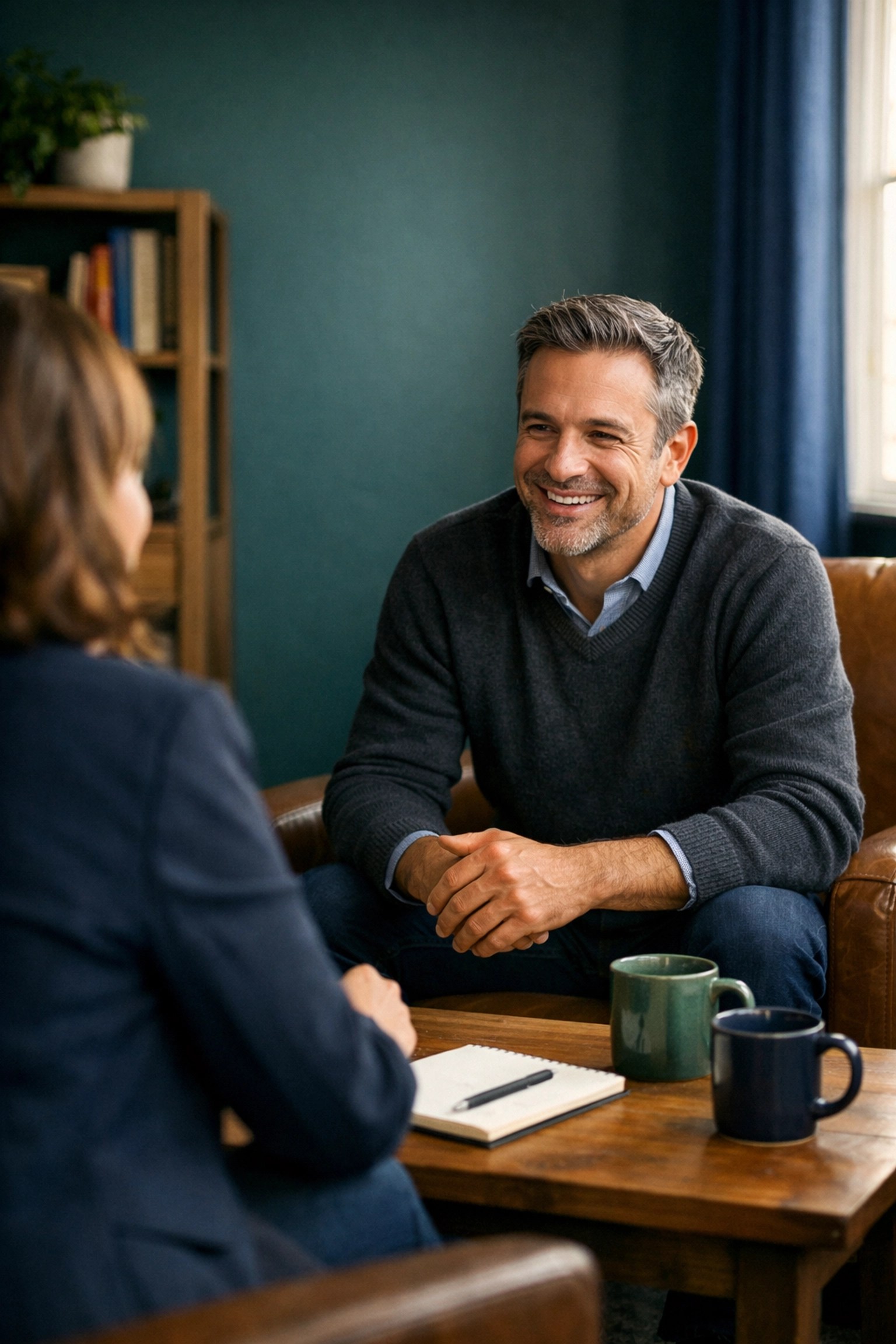 Business advisor in a coaching session focusing on human relationships and customer retention strategy.