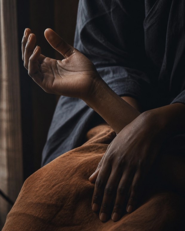 Relaxed hands and wrists moving slowly in soft natural light