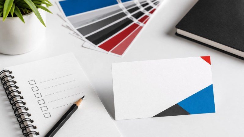 Balanced business card workspace with checklist and color swatches