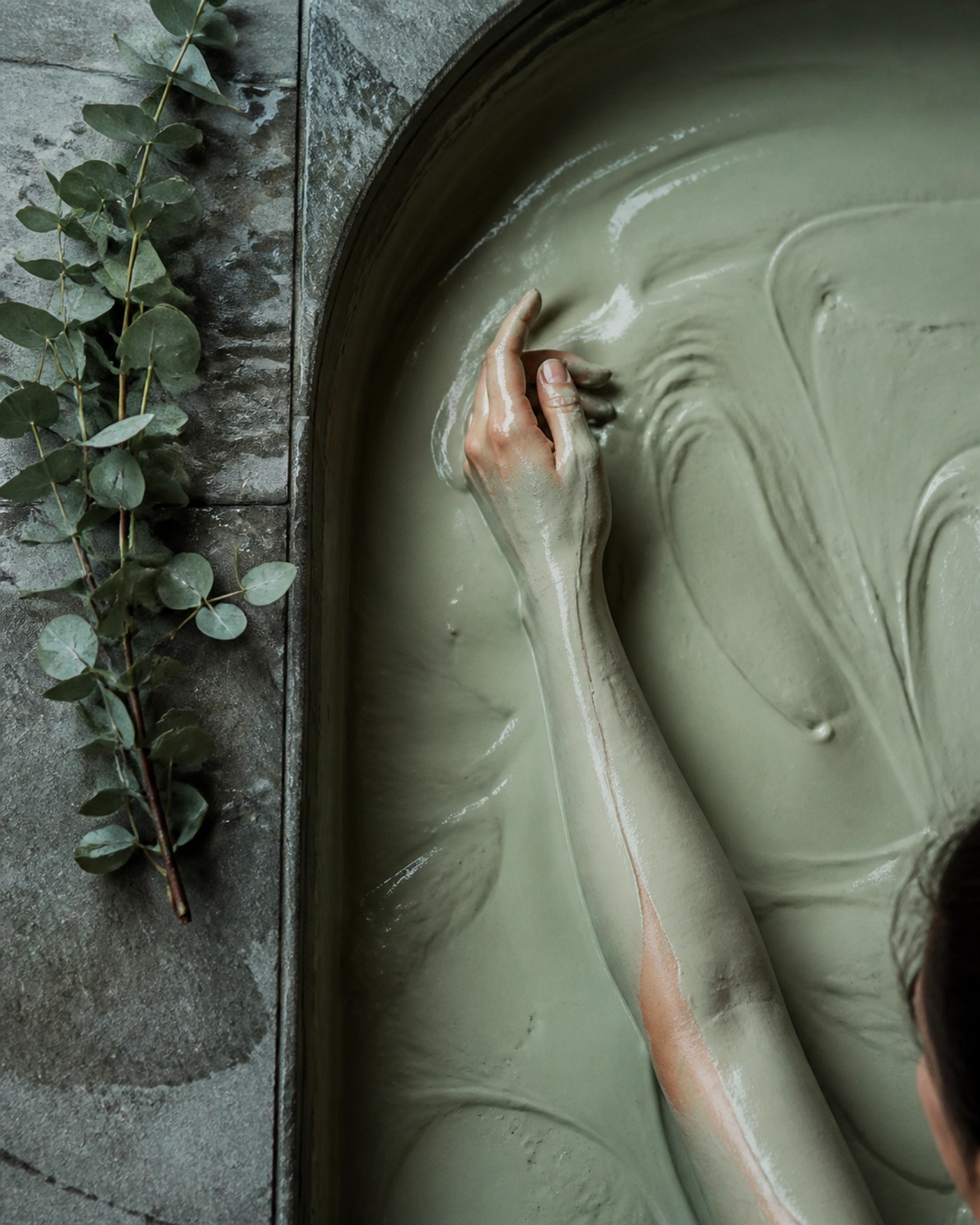 A relaxing mineral-rich green clay bath used for natural skin detox and holistic toxin binding.