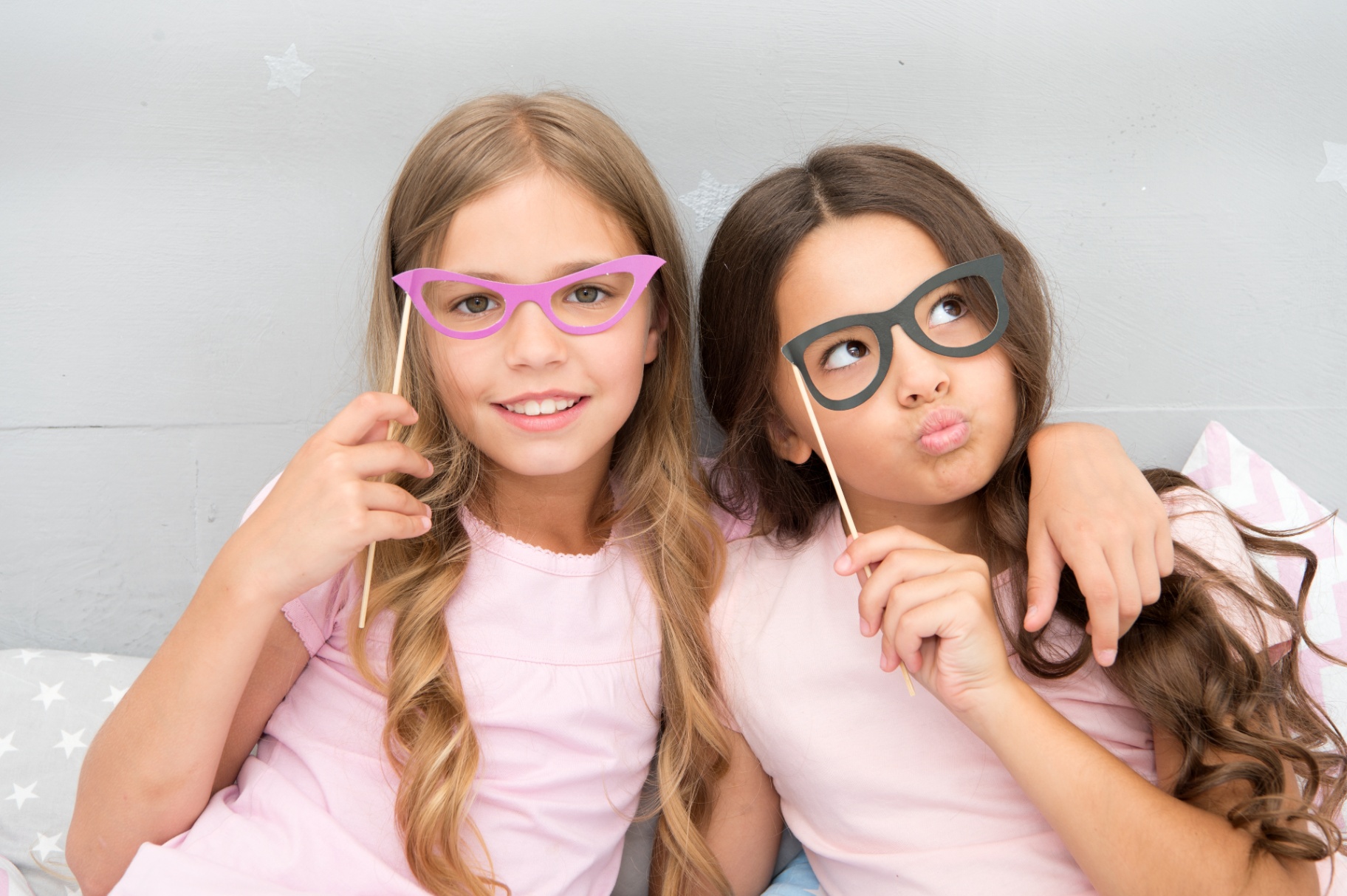 Two Young Girls with Paper Glasses Props