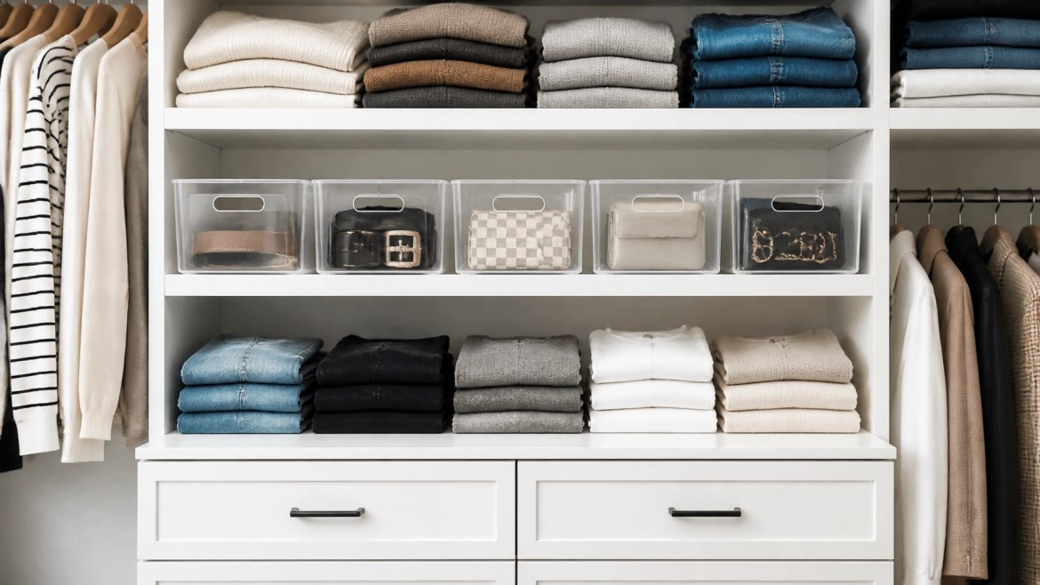 Neatly organized closet with folded clothes and storage bins