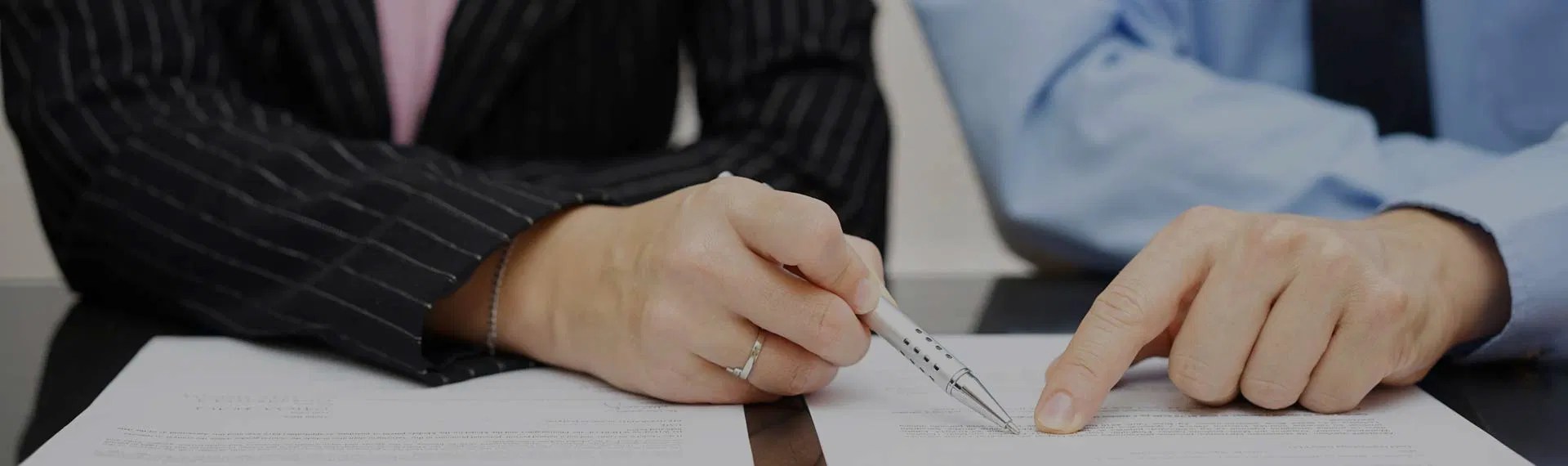 Professionals reviewing compliance documents for 340B rebate model implementation