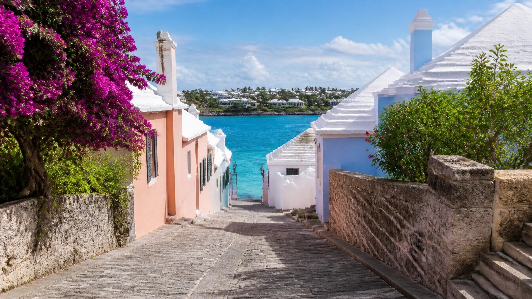 Pastel colonial buildings and a turquoise harbor in historic St. George’s, Bermuda