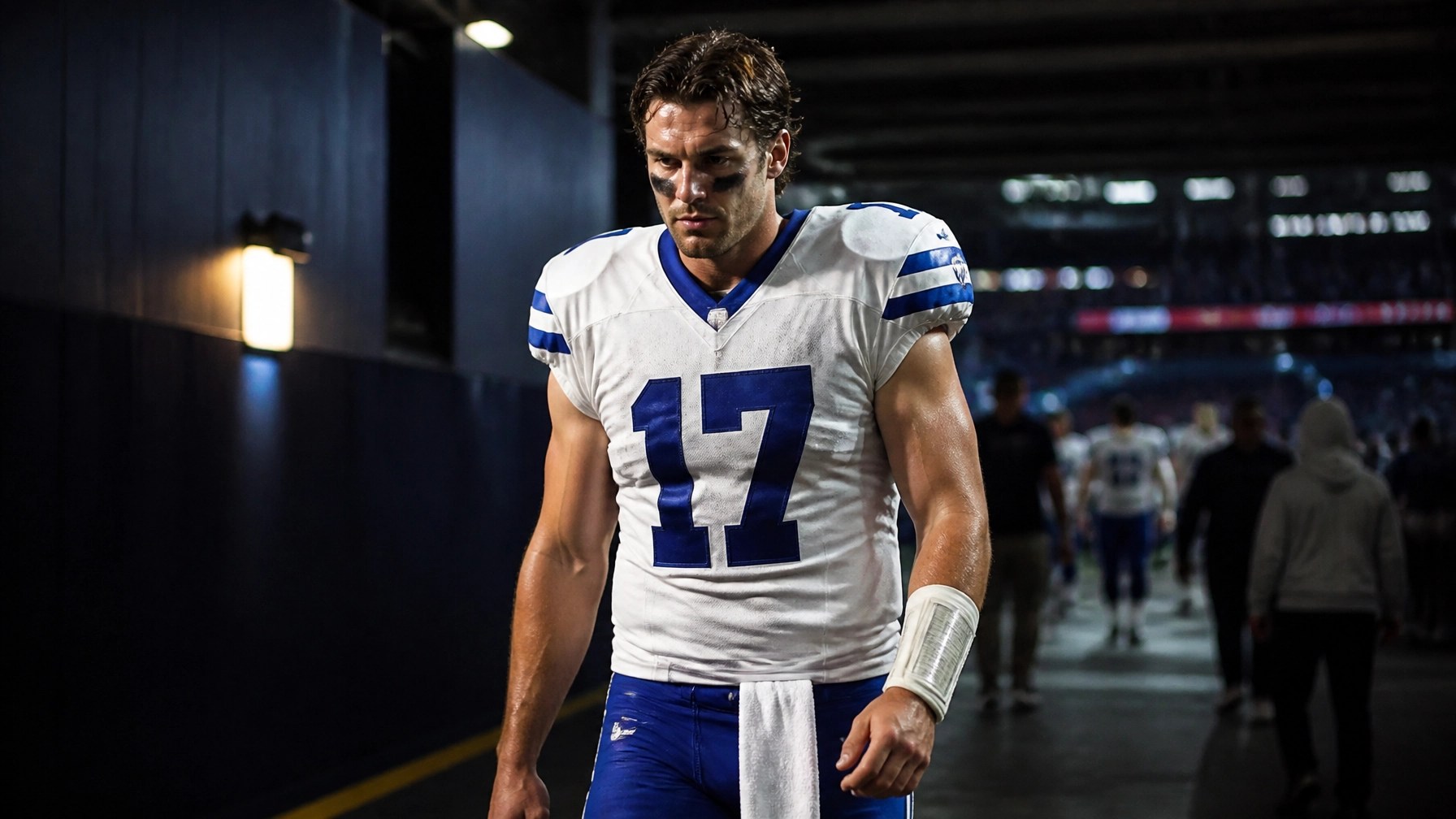 NFL player walking down a stadium tunnel after a game