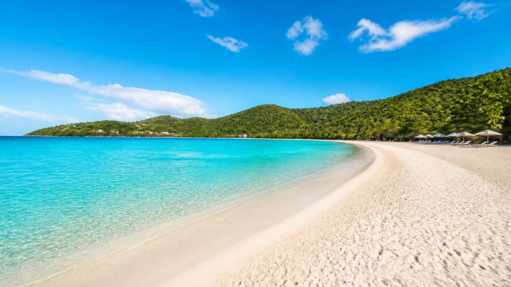 Pristine crescent-shaped Magens Bay with turquoise water and green hills