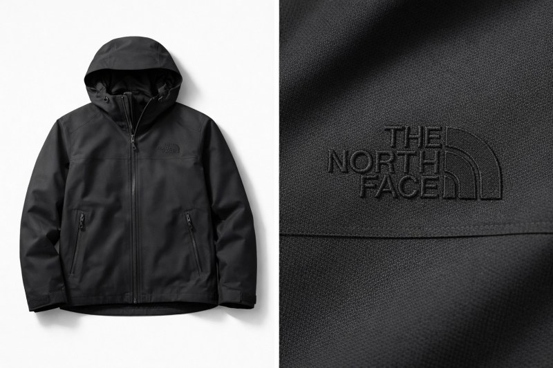 Premium black jacket with subtle tonal embroidery showing quiet luxury custom apparel branding