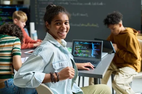 A real ASCEND Academy learner working on coding and digital skills, showing the kind of focused afterschool effort that builds college readiness.