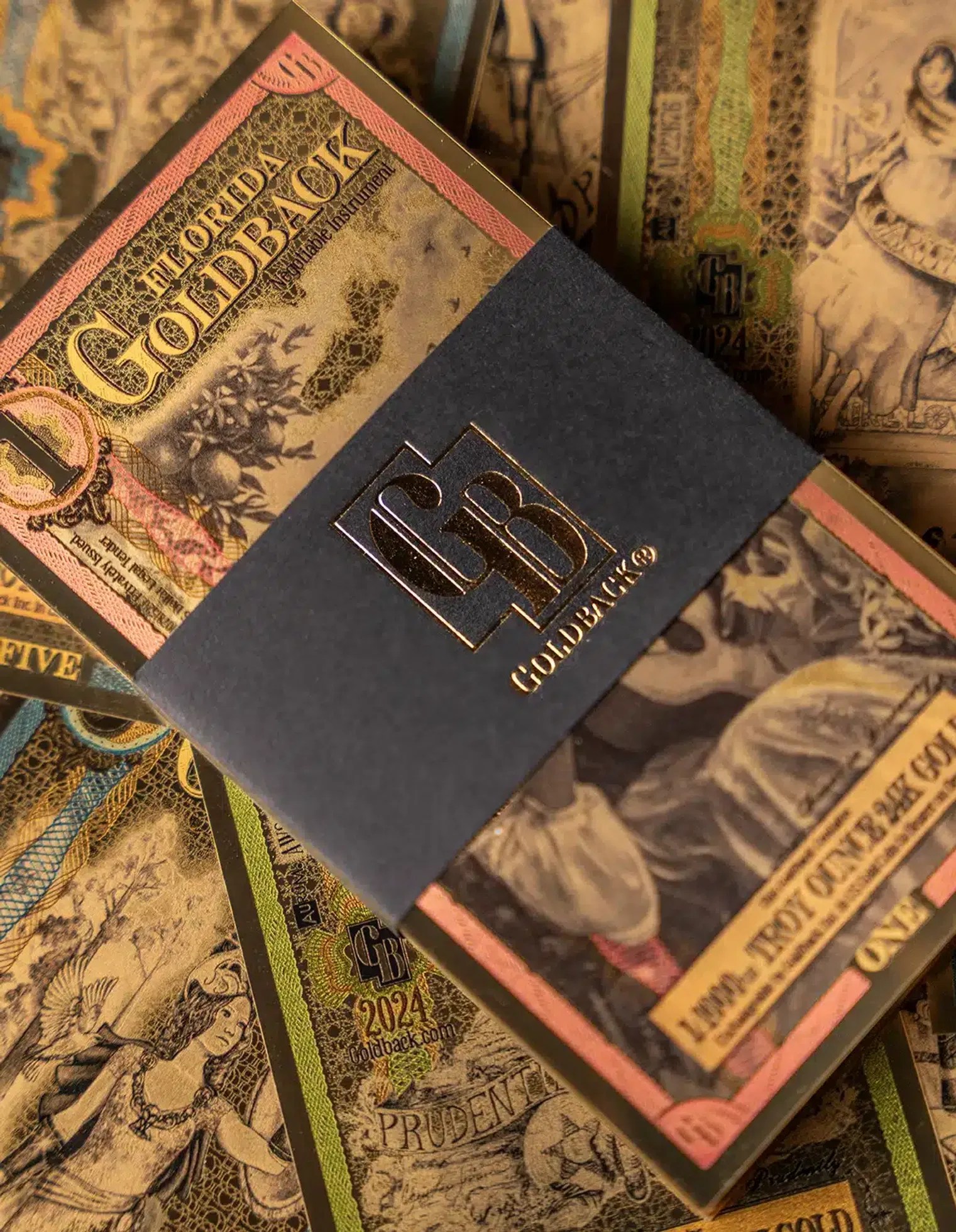 Close-up of physical Goldback currency highlighting intricate security and artistic details