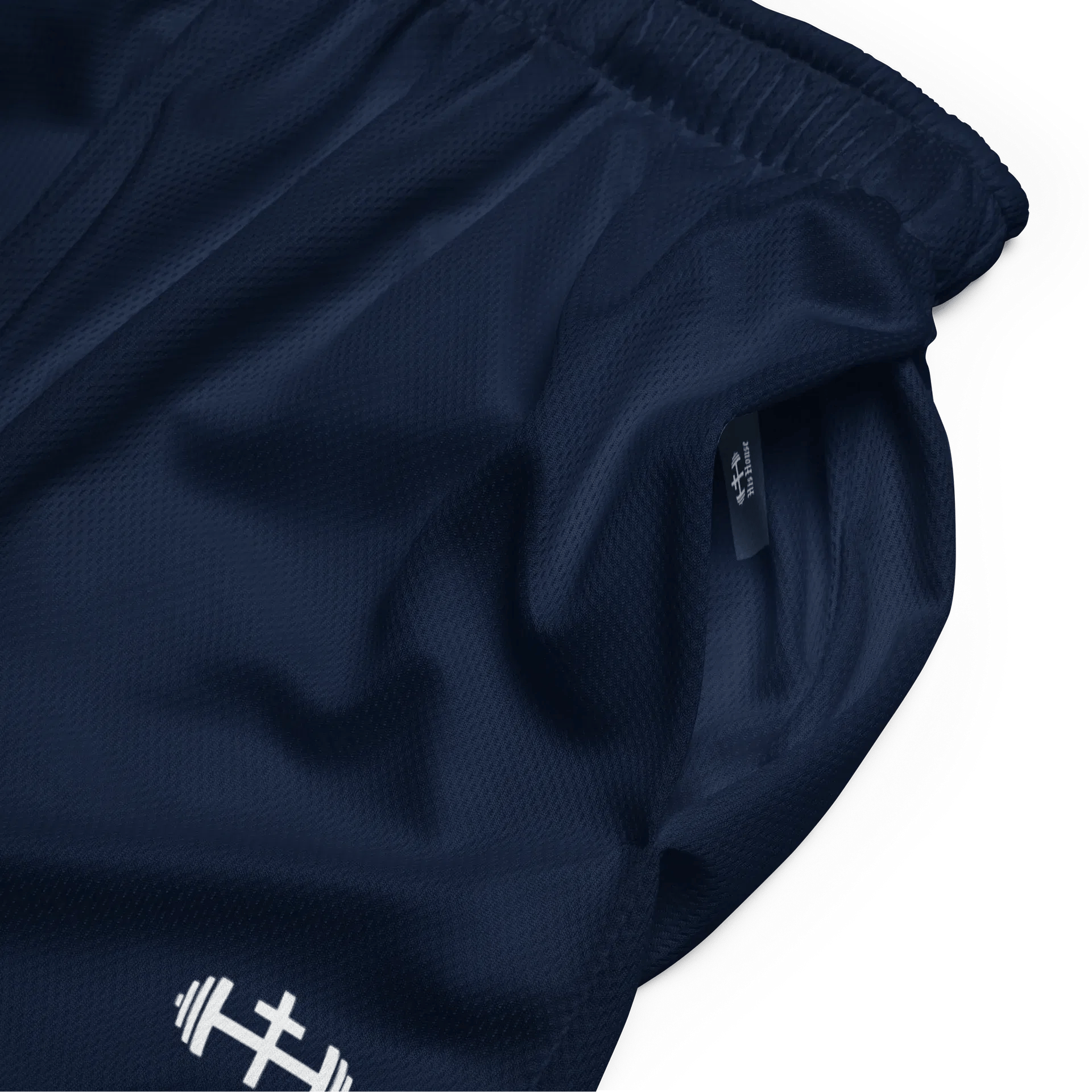 Close-up of navy performance mesh fabric with subtle His House branding