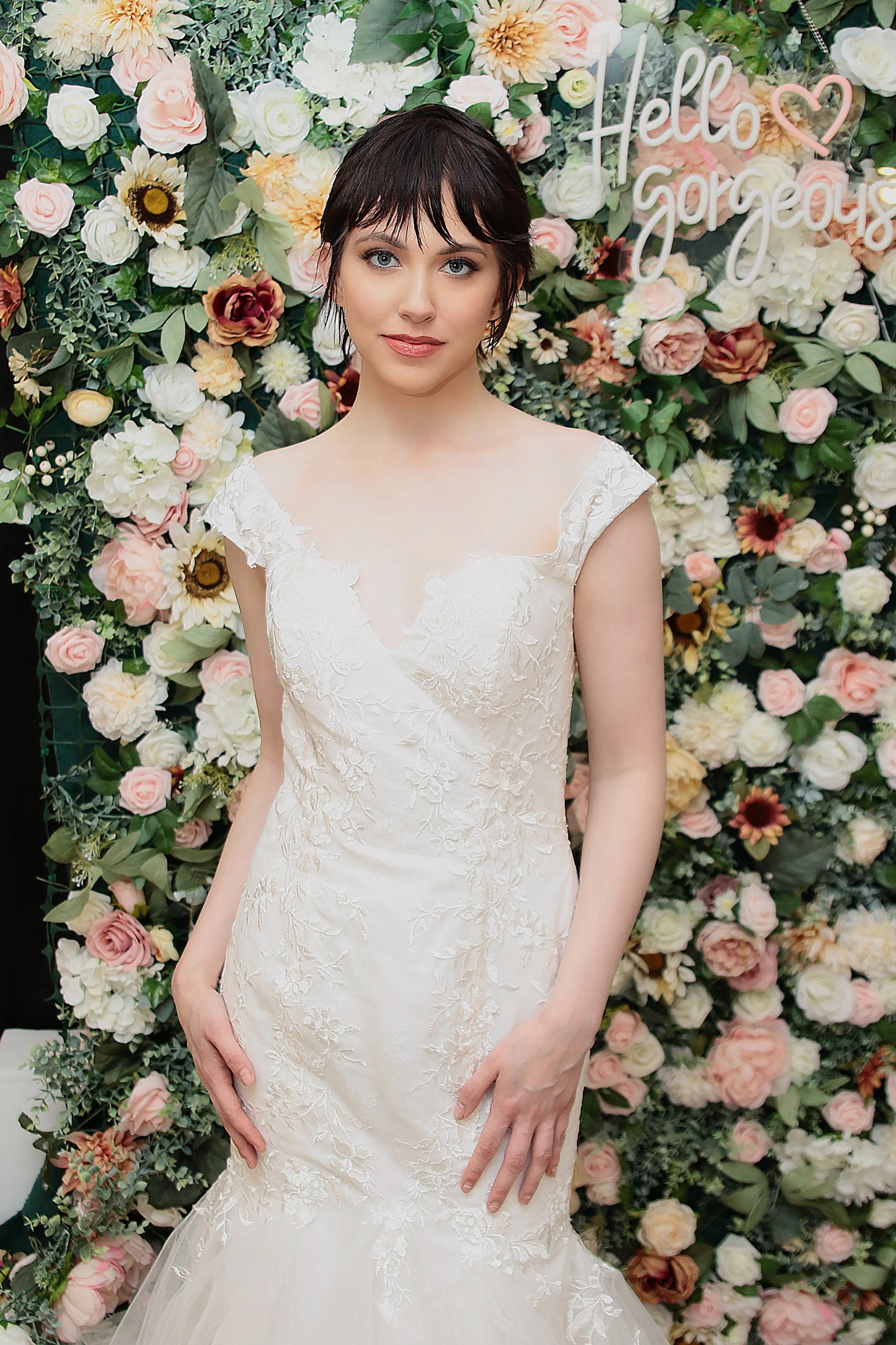 A modern and stylish wedding setup with a 'Hello gorgeous' neon sign