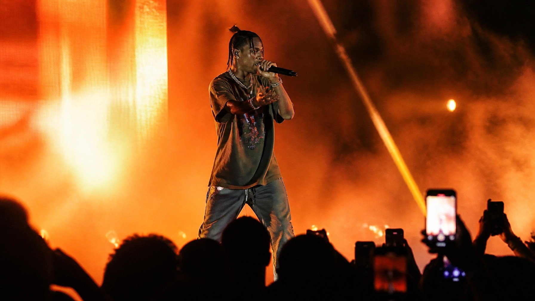 A hip-hop artist performing on a stage with vibrant lighting, capturing the energy of independent success.