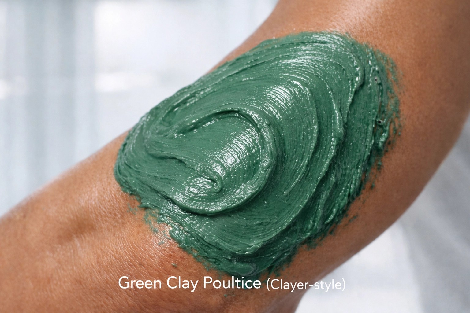 Close-up of green clay (healing clay) poultice on an athlete’s arm for recovery — Clayer-style.