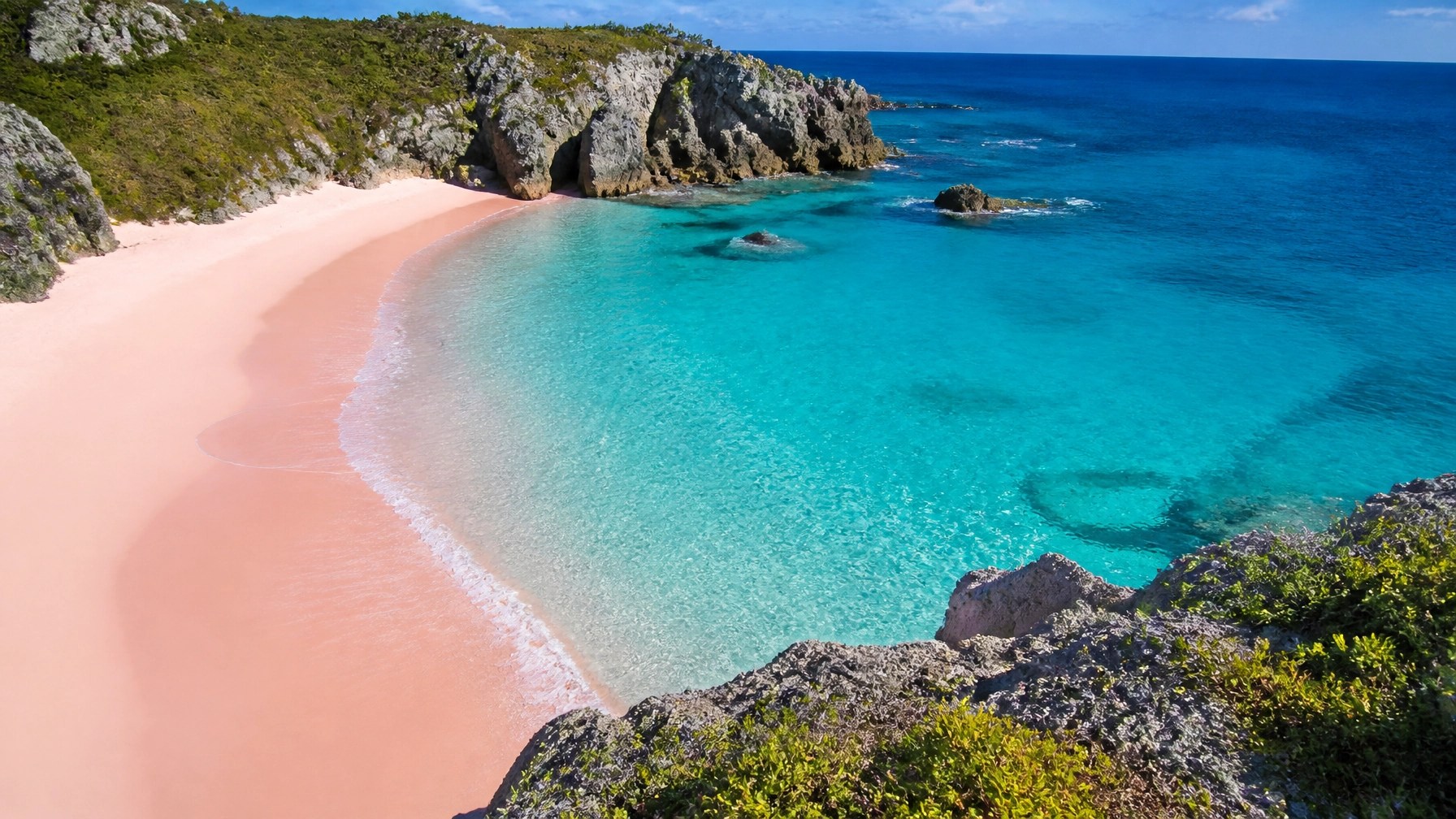 Horseshoe Bay Beach in Bermuda with pink sand, turquoise water, and limestone cliffs