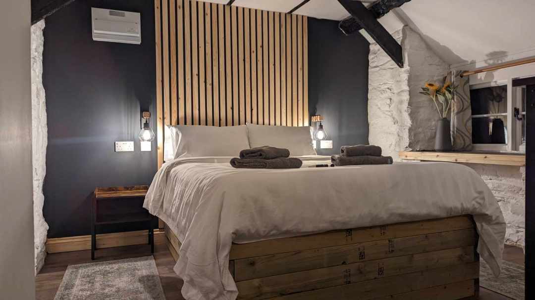 The cozy king-size bed in The Lodge House - perfect for a post-hike nap
