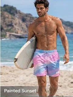 Men’s faith-inspired swim trunks on a beach near the ocean