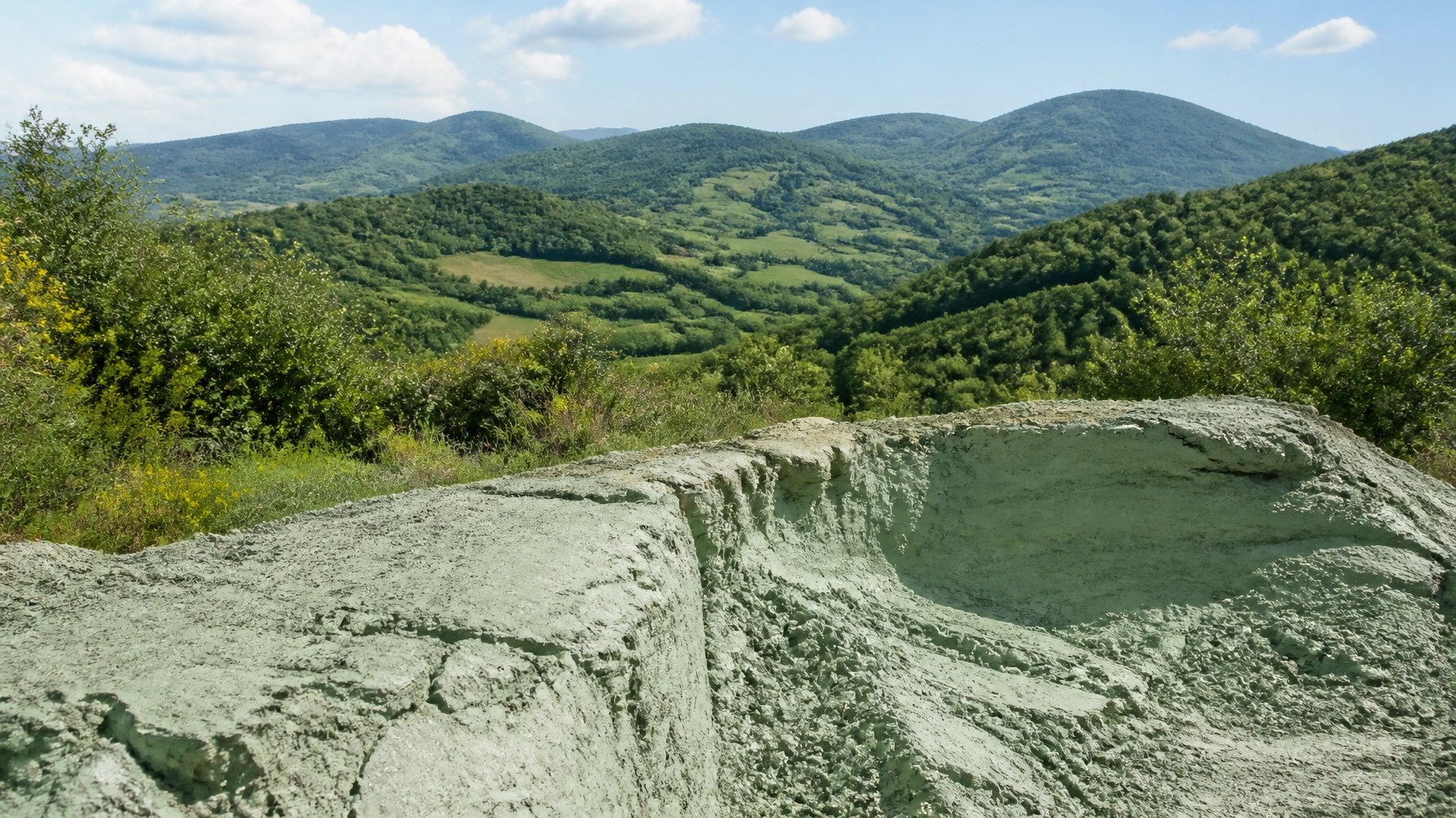 A serene landscape representing the pure source of high-quality French green clay