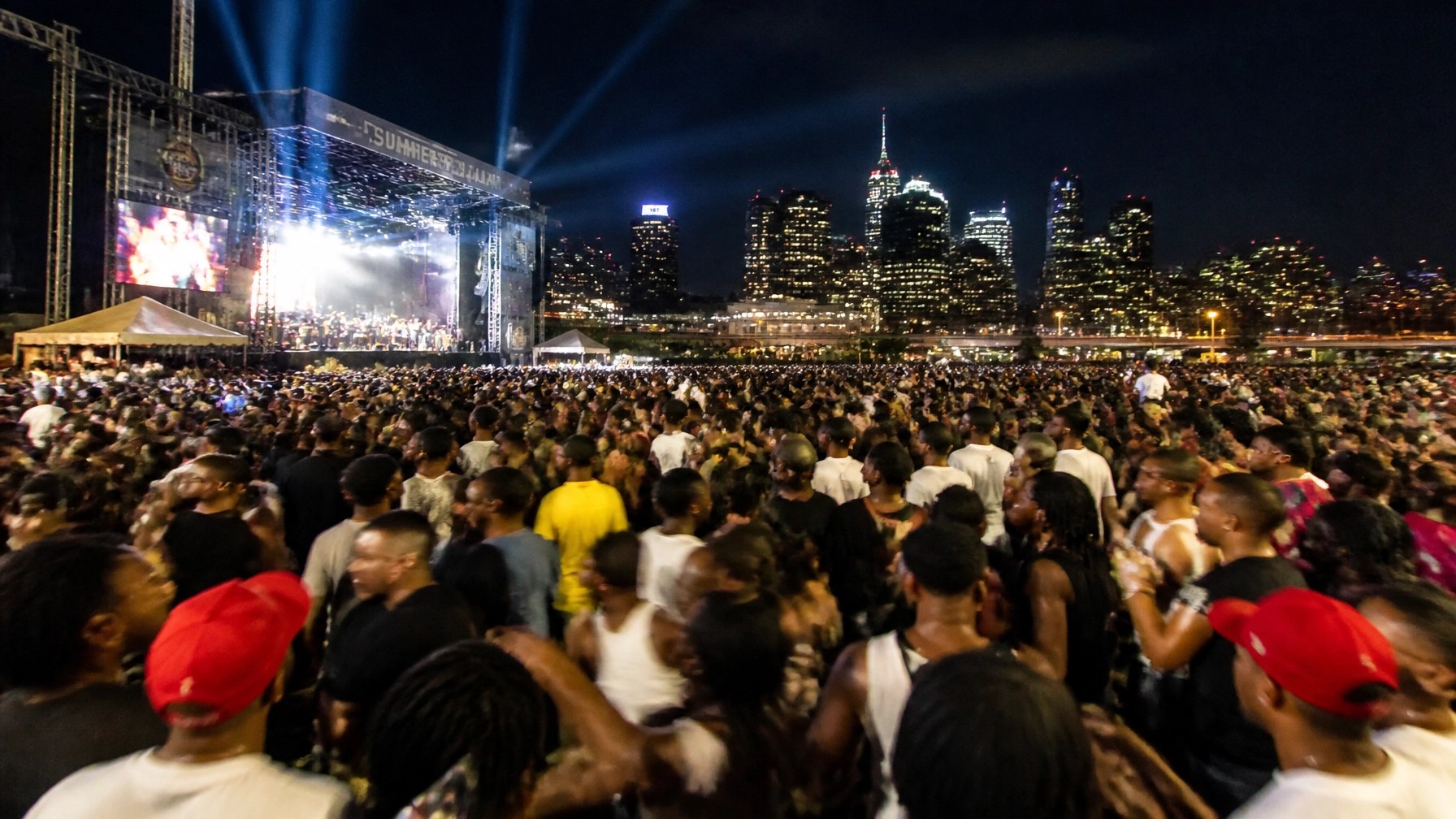 High-energy concert crowd in the Tri-state area reflecting the weekend's entertainment vibes