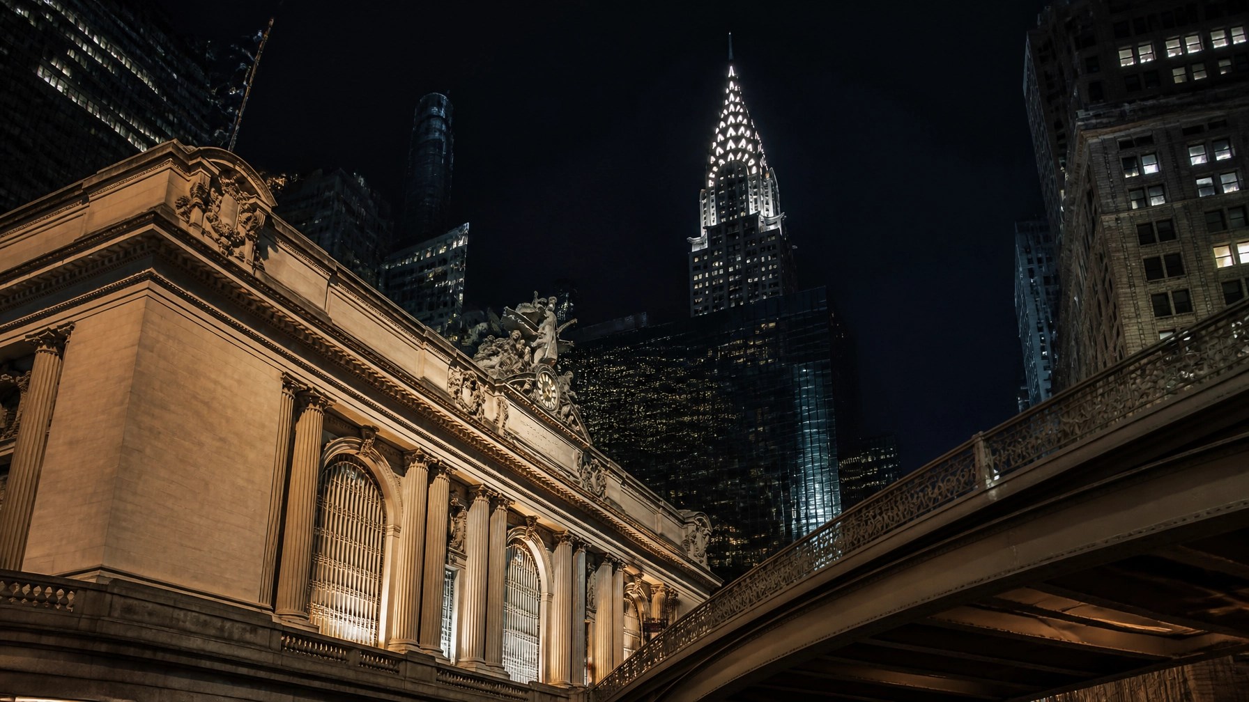 Fresh nighttime view of iconic New York architecture with glowing windows, elegant lines, and dramatic city light.