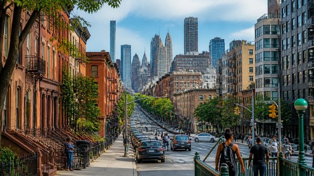 Brooklyn and Queens residential corridor showing tree-lined housing, modern apartments and strong neighborhood demand