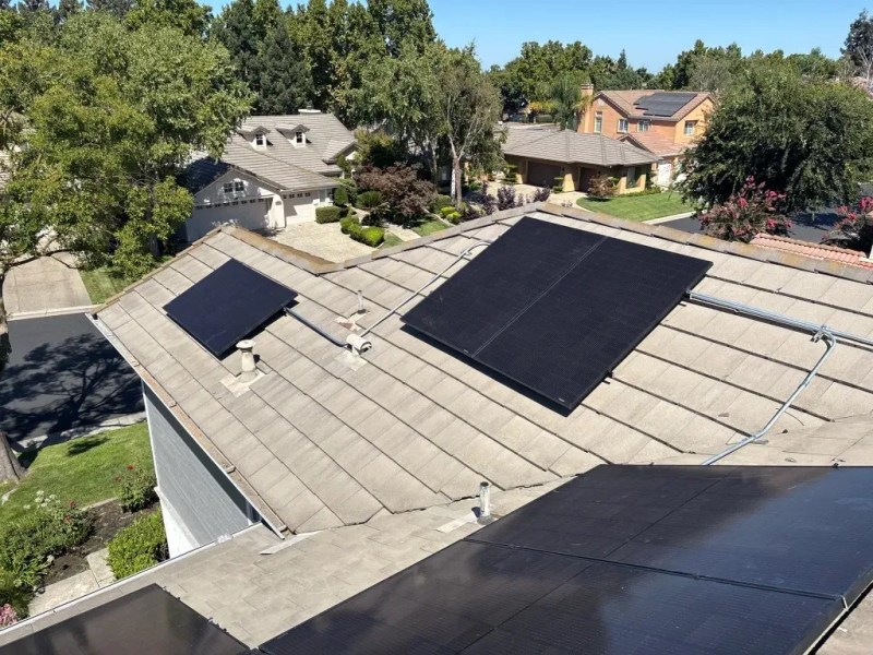 High-angle view of a completed residential solar array on a California roof