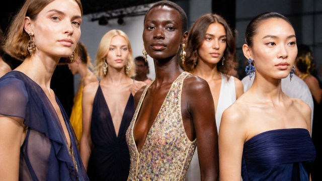 Models presenting late summer designer collections at a Manhattan runway event
