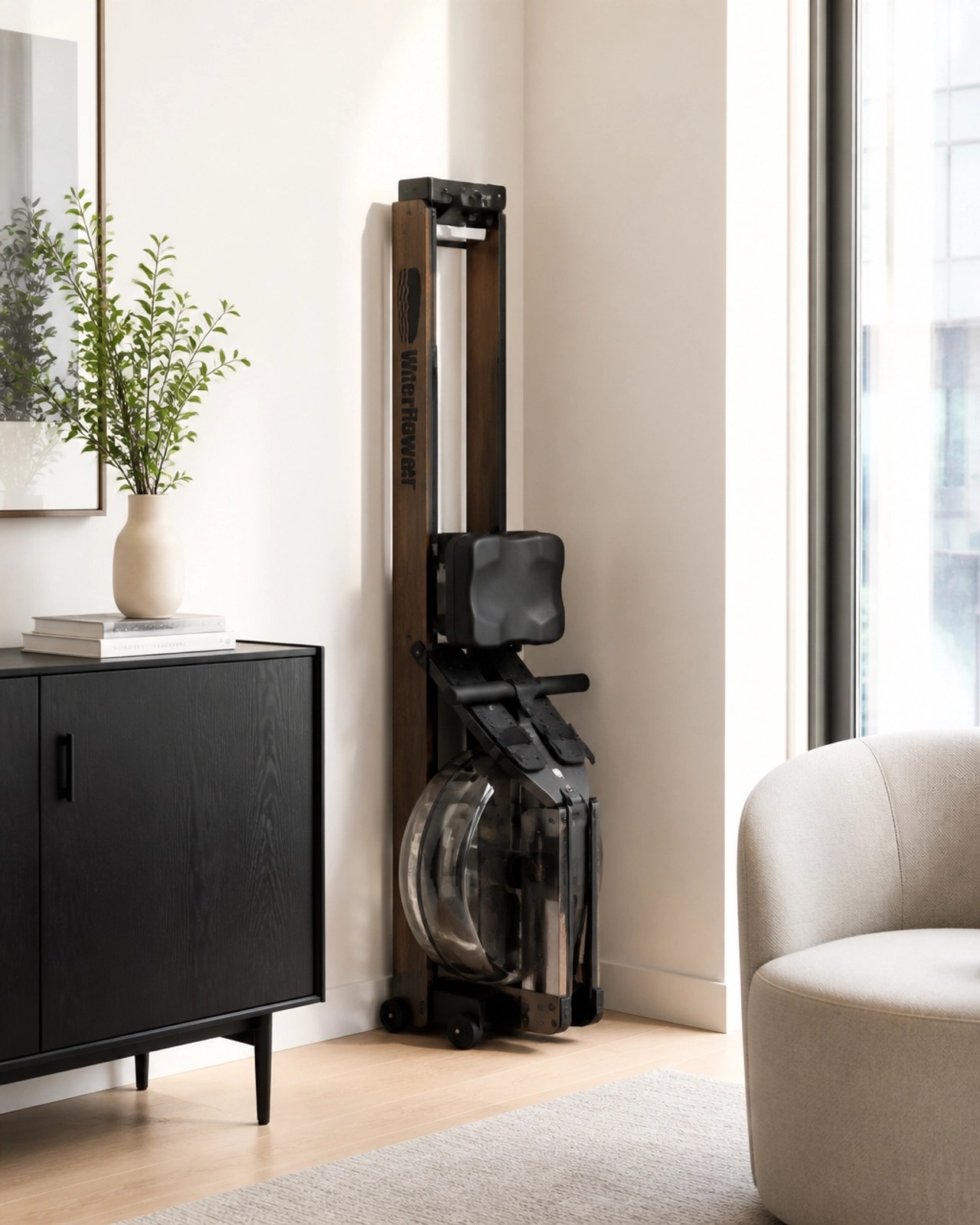 A folding rowing machine tucked away neatly in a modern apartment